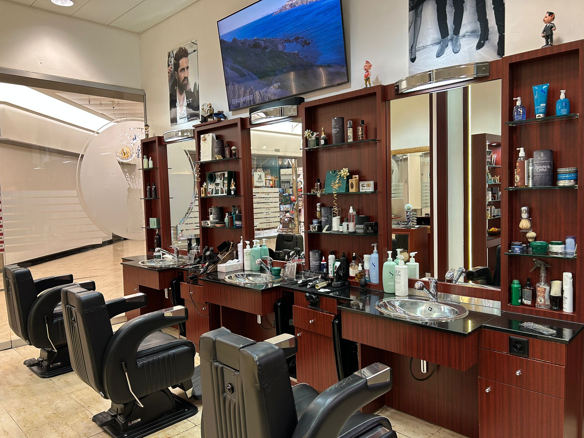 MC Le Barbier main salon with multiple barber chairs