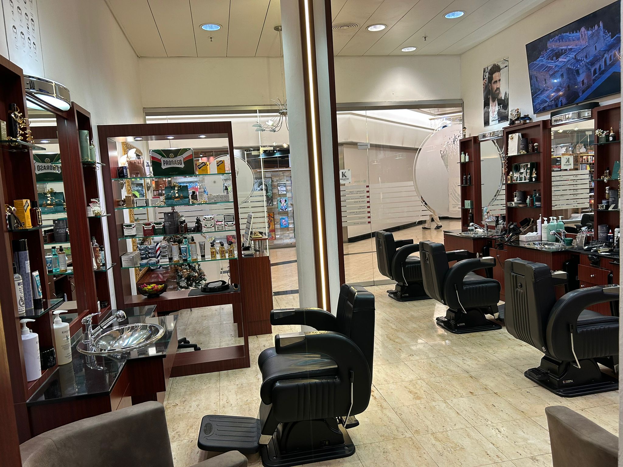 MC Le Barbier salon interior with barber chairs and product displays